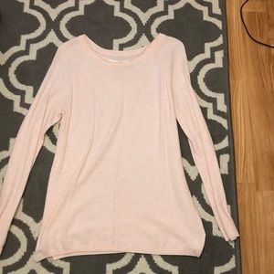 A pale pink sweater